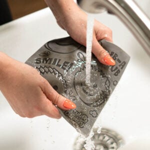 Rinsing off Damp Duster Towel