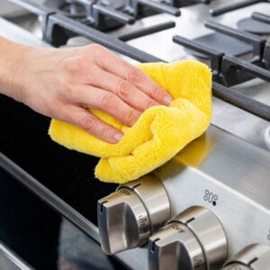 Using a Microfiber Cloth to clean stove