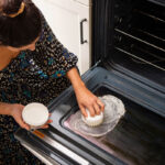 Cleaning an oven door with PowerPaste and a Dye-Free Scrub Mommy